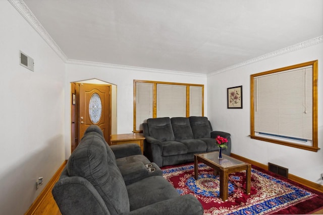 living room with hardwood / wood-style flooring and ornamental molding