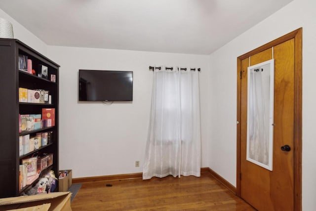 interior space with dark hardwood / wood-style flooring