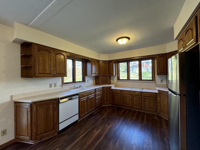 kitchen with stainless steel fridge, sink, white dishwasher, and dark hardwood / wood-style floors