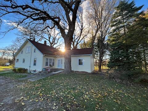 rear view of property with a lawn and a patio area