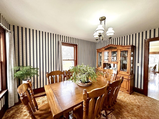 dining space featuring an inviting chandelier