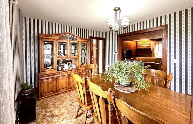 dining space featuring a notable chandelier