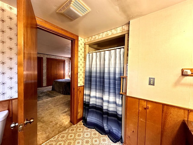 bathroom with wooden walls