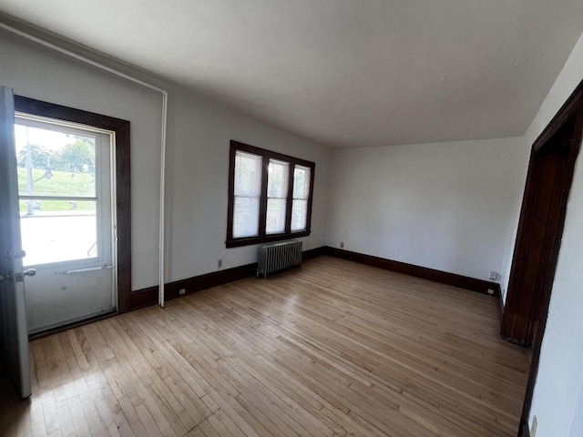 entryway featuring radiator heating unit and light hardwood / wood-style flooring