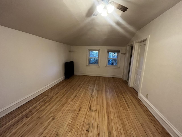 bonus room with vaulted ceiling, light hardwood / wood-style flooring, and ceiling fan