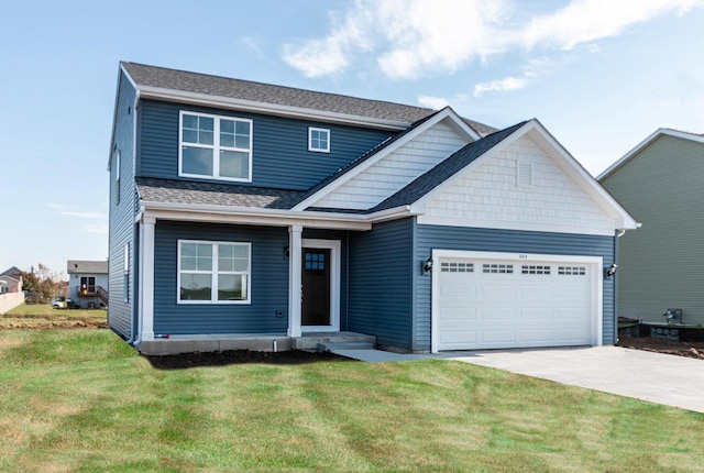 craftsman inspired home with a garage and a front yard