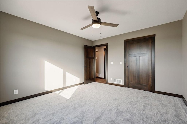 unfurnished bedroom featuring carpet and ceiling fan