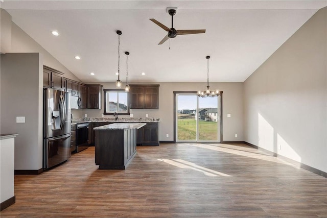 kitchen with pendant lighting, a center island, wood-type flooring, and stainless steel appliances