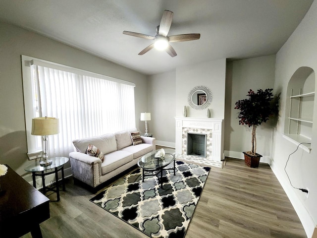 living room with hardwood / wood-style floors and ceiling fan