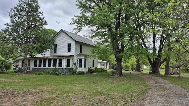 33135 Fulton St, Lone Rock, WI 53556 - view of front of home featuring a front lawn