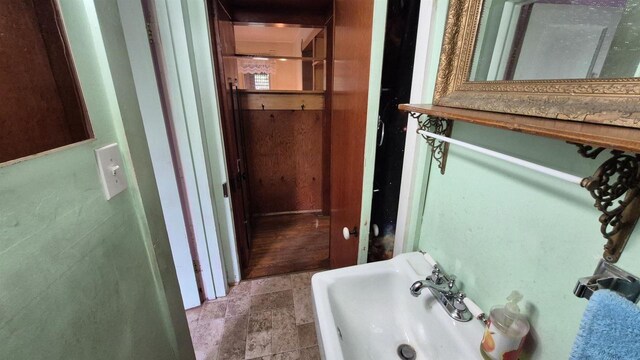 33135 Fulton St, Lone Rock, WI 53556 - bathroom featuring stone finish floors and a sink