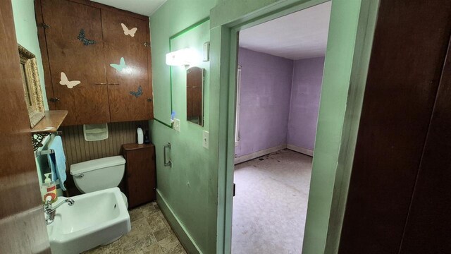 33135 Fulton St, Lone Rock, WI 53556 - bathroom featuring a sink, toilet, and baseboards
