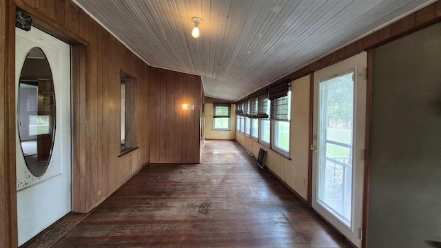 33135 Fulton St, Lone Rock, WI 53556 - hall featuring wood walls, dark wood-style floors, wood ceiling, and arched walkways