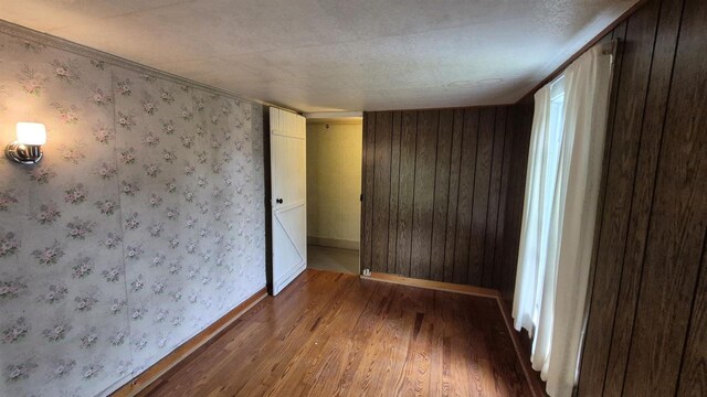 33135 Fulton St, Lone Rock, WI 53556 - empty room with wood finished floors and baseboards