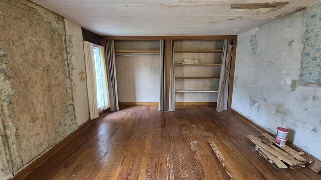 33135 Fulton St, Lone Rock, WI 53556 - unfurnished bedroom featuring wood-type flooring