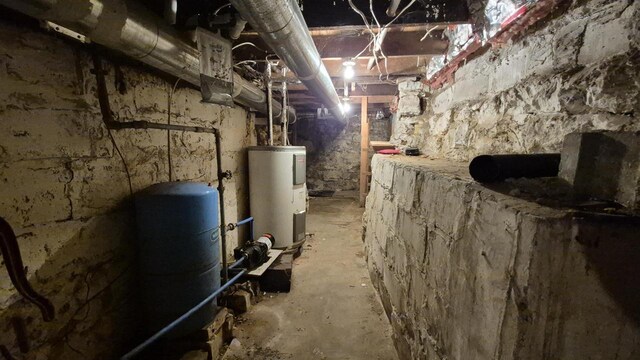 33135 Fulton St, Lone Rock, WI 53556 - unfinished basement with water heater and a water pressure tank