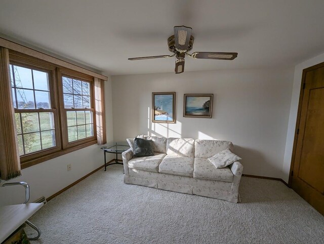 living room featuring ceiling fan and light carpet