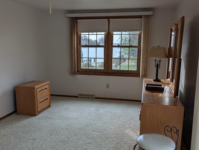 empty room featuring light carpet