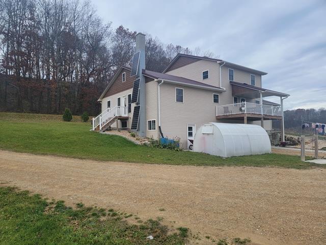 view of home's exterior with a yard