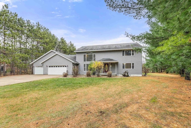 view of front of property with a garage and a front yard