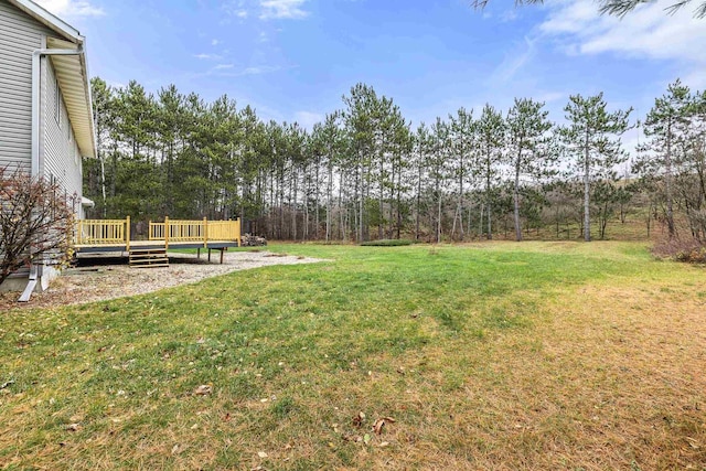 view of yard featuring a wooden deck