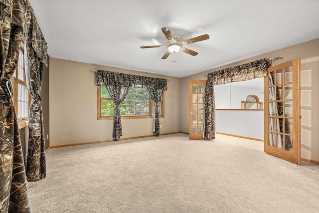 unfurnished room with carpet flooring and ceiling fan