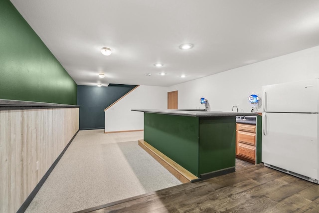 bar with white refrigerator, dark hardwood / wood-style flooring, and light brown cabinets