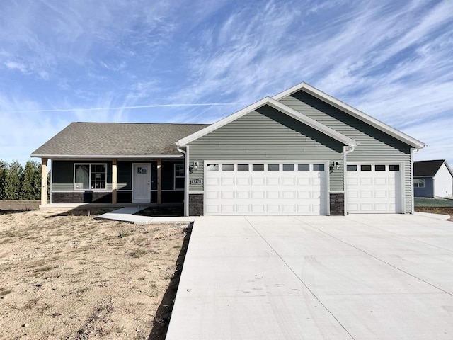 ranch-style home featuring a porch and a garage