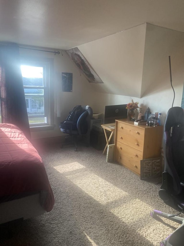 carpeted bedroom with lofted ceiling