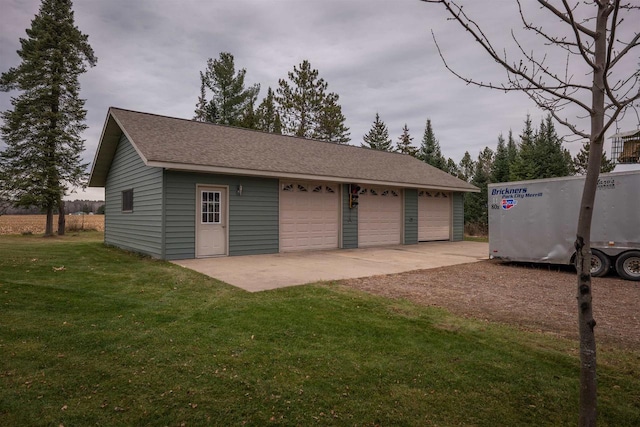 garage featuring a lawn