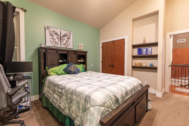 bedroom featuring carpet flooring and lofted ceiling