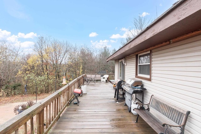 wooden deck featuring area for grilling