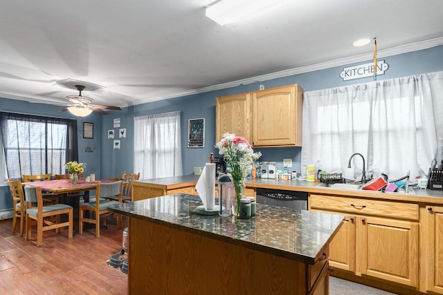 kitchen with ornamental molding, ceiling fan, wood-type flooring, dishwasher, and a kitchen island