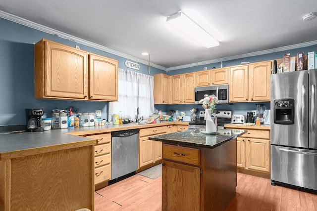 kitchen featuring a kitchen island, crown molding, light wood-type flooring, and stainless steel appliances