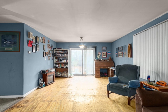 sitting room featuring wood-type flooring