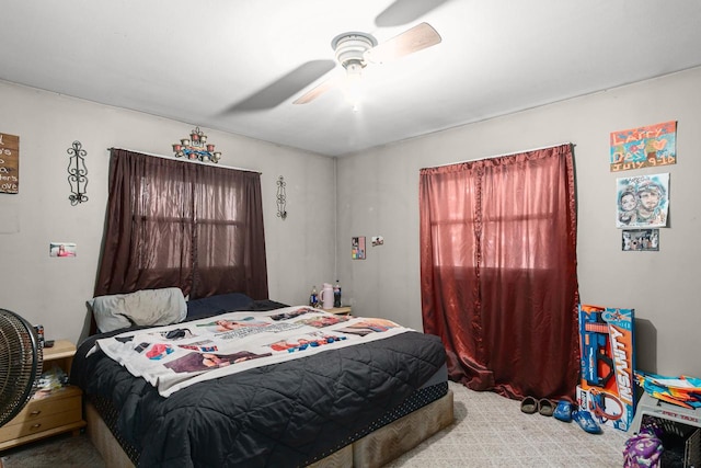 bedroom with light colored carpet and ceiling fan