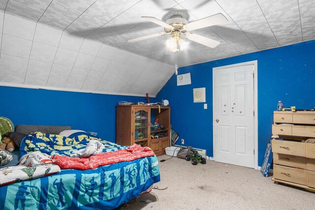 bedroom featuring carpet, ceiling fan, and lofted ceiling