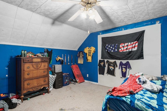 bedroom with ceiling fan, carpet floors, and lofted ceiling