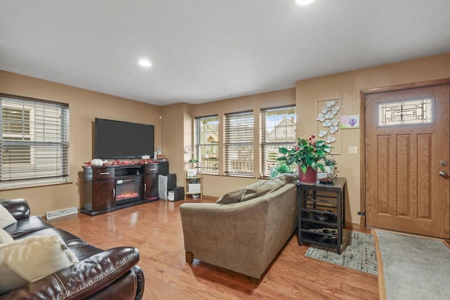 living room with light hardwood / wood-style floors