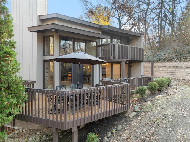 rear view of property with a wooden deck