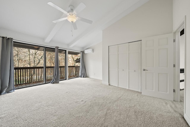 interior space with vaulted ceiling with beams, carpet floors, ceiling fan, and a healthy amount of sunlight