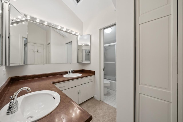 full bathroom featuring tile patterned flooring, combined bath / shower with glass door, vaulted ceiling, toilet, and vanity