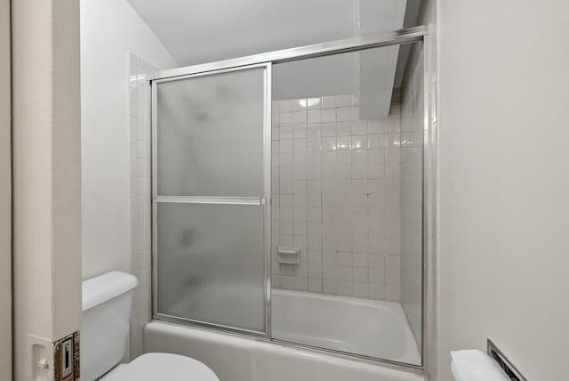 bathroom featuring toilet, bath / shower combo with glass door, and a baseboard radiator