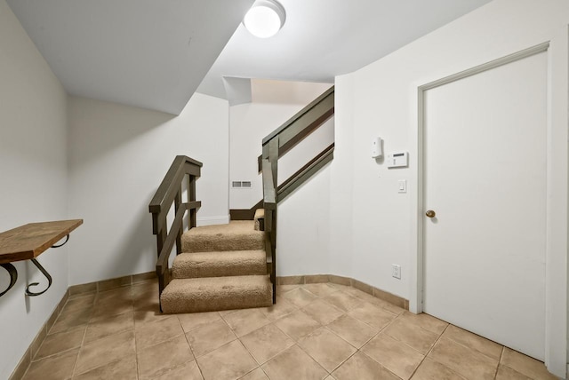 staircase with tile patterned flooring