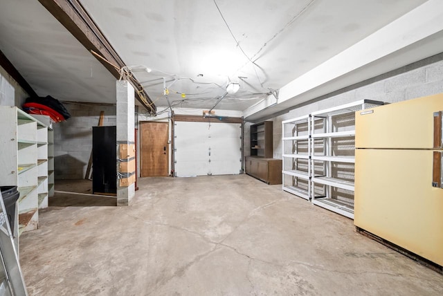 garage featuring white fridge