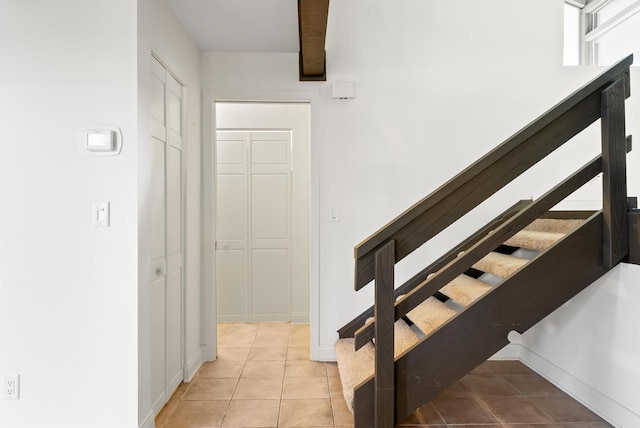 stairs with tile patterned floors