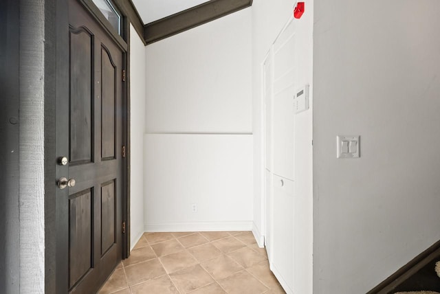 hall with light tile patterned flooring