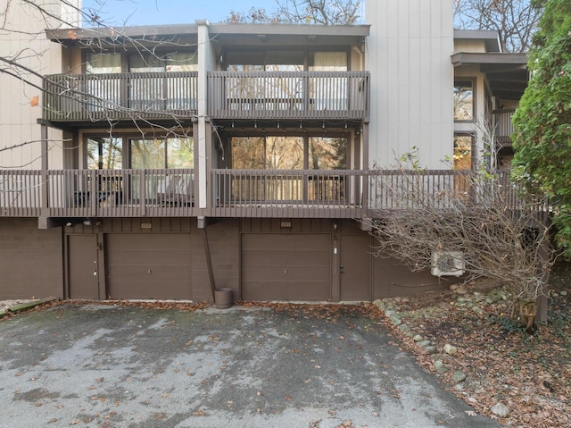 rear view of house with a garage