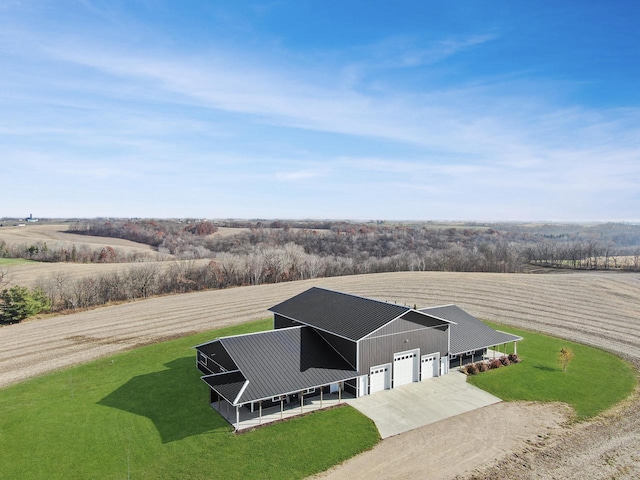 birds eye view of property with a rural view