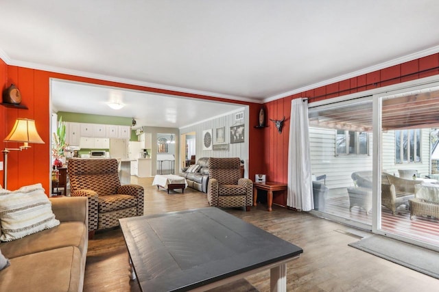 living room featuring crown molding and dark hardwood / wood-style floors